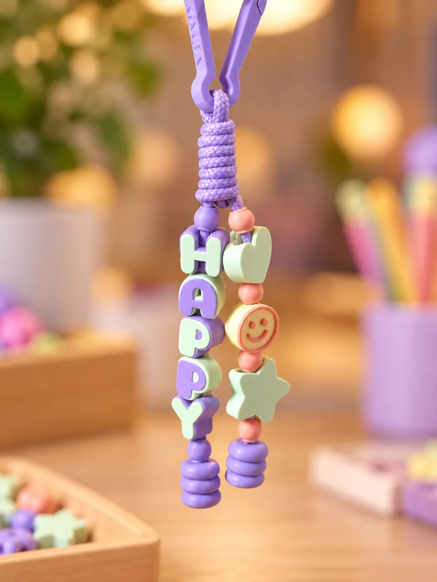 Chaveiro HAPPY lilás e menta com coração, sorriso e estrela